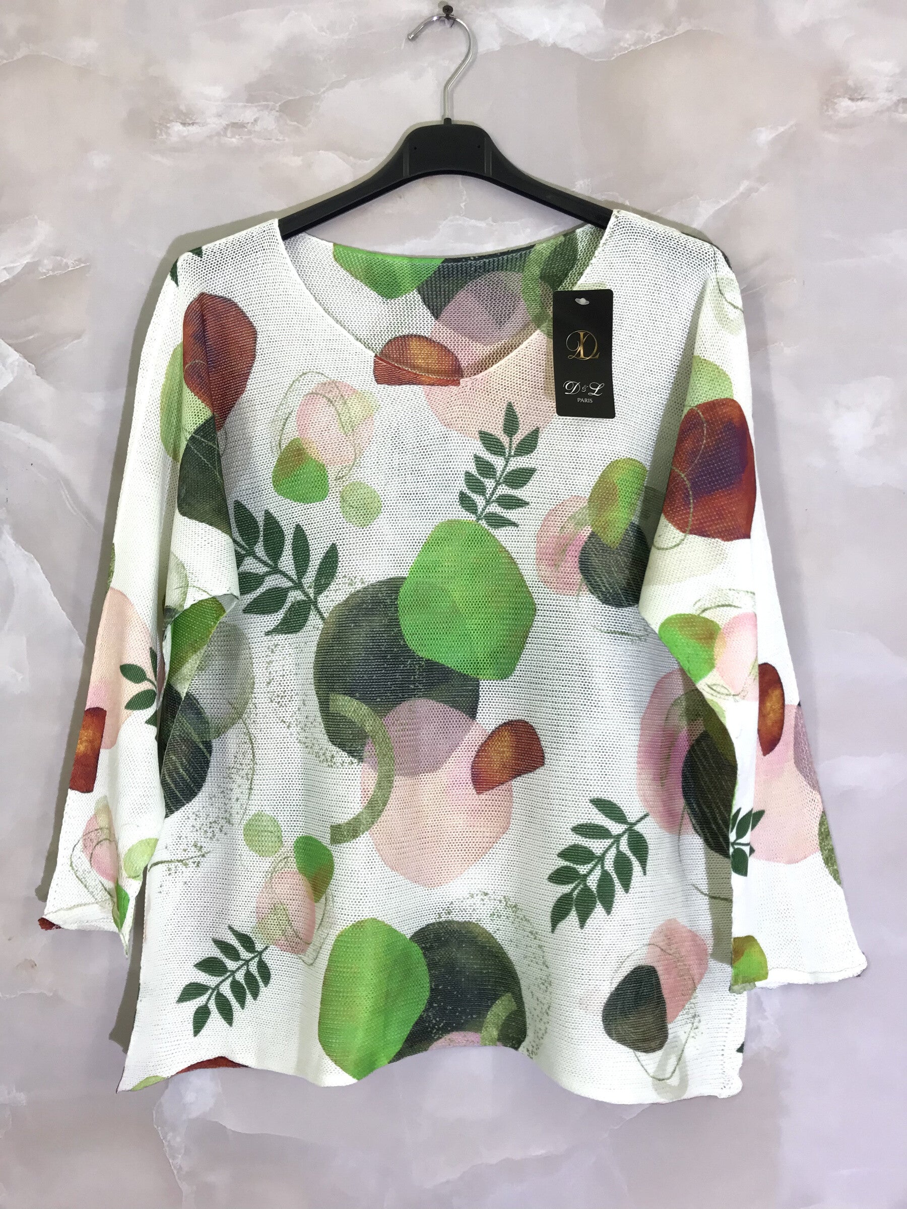 Stickad tunika med färgglada tryck i plus size