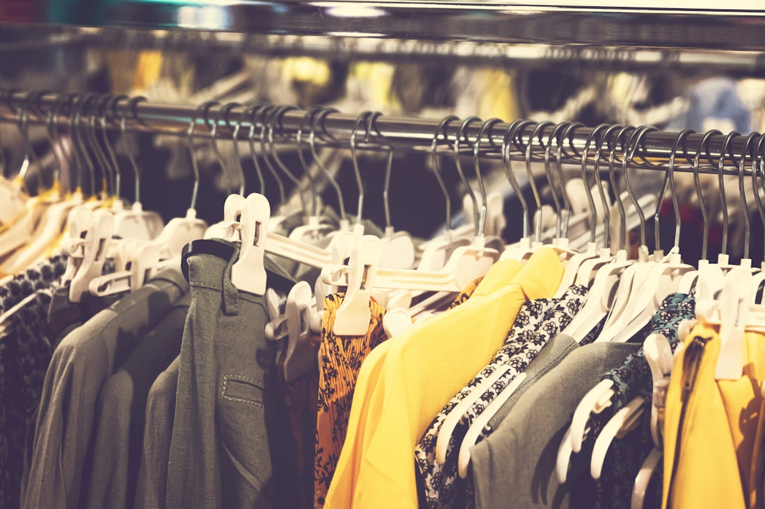 men's clothes displayed on a rack