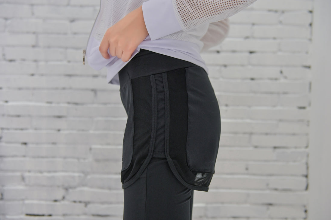 person in black pants and white long sleeve shirt