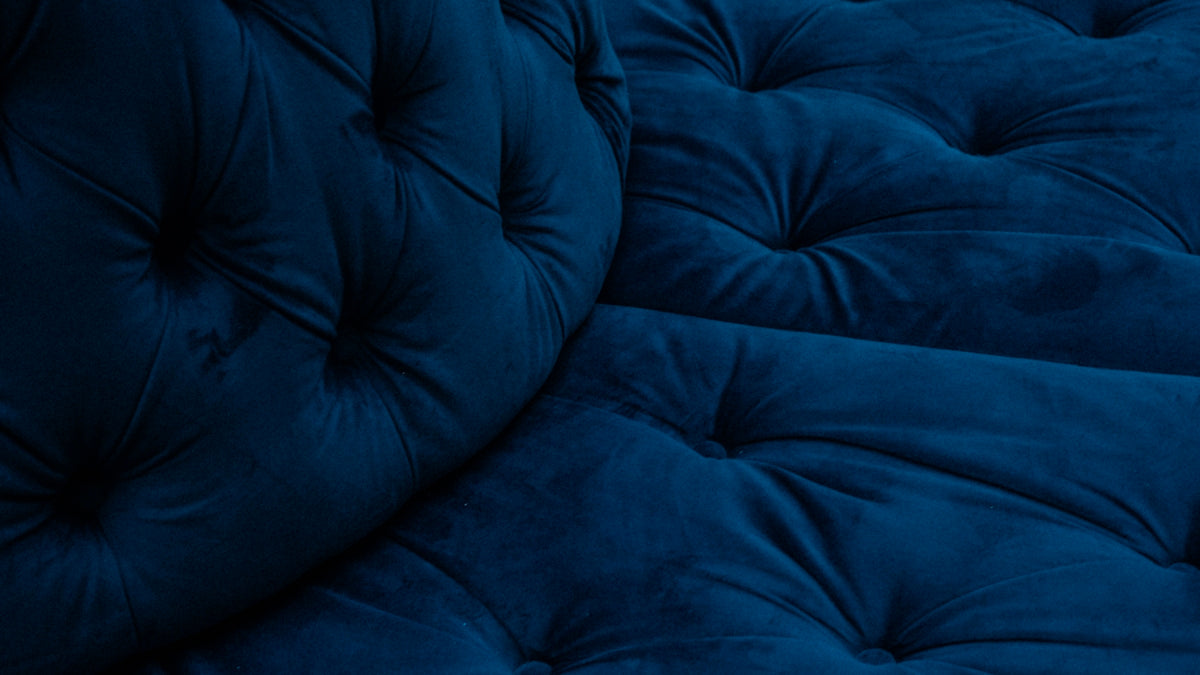a close up of a blue couch cushion
