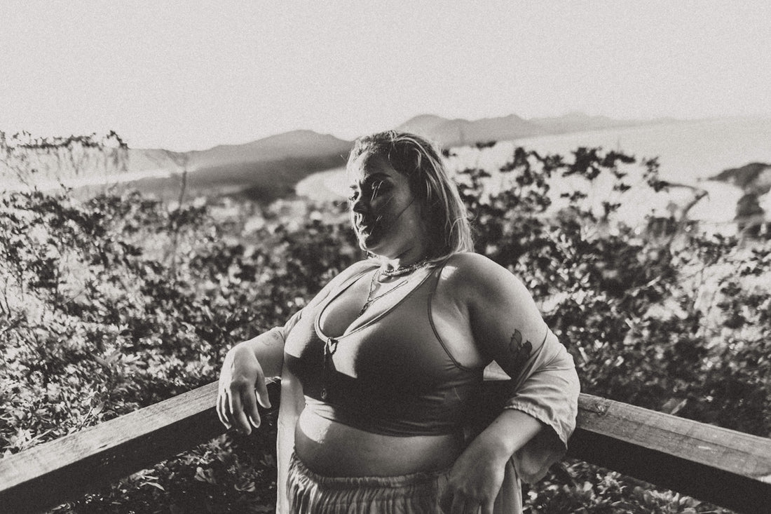a woman sitting on a ledge