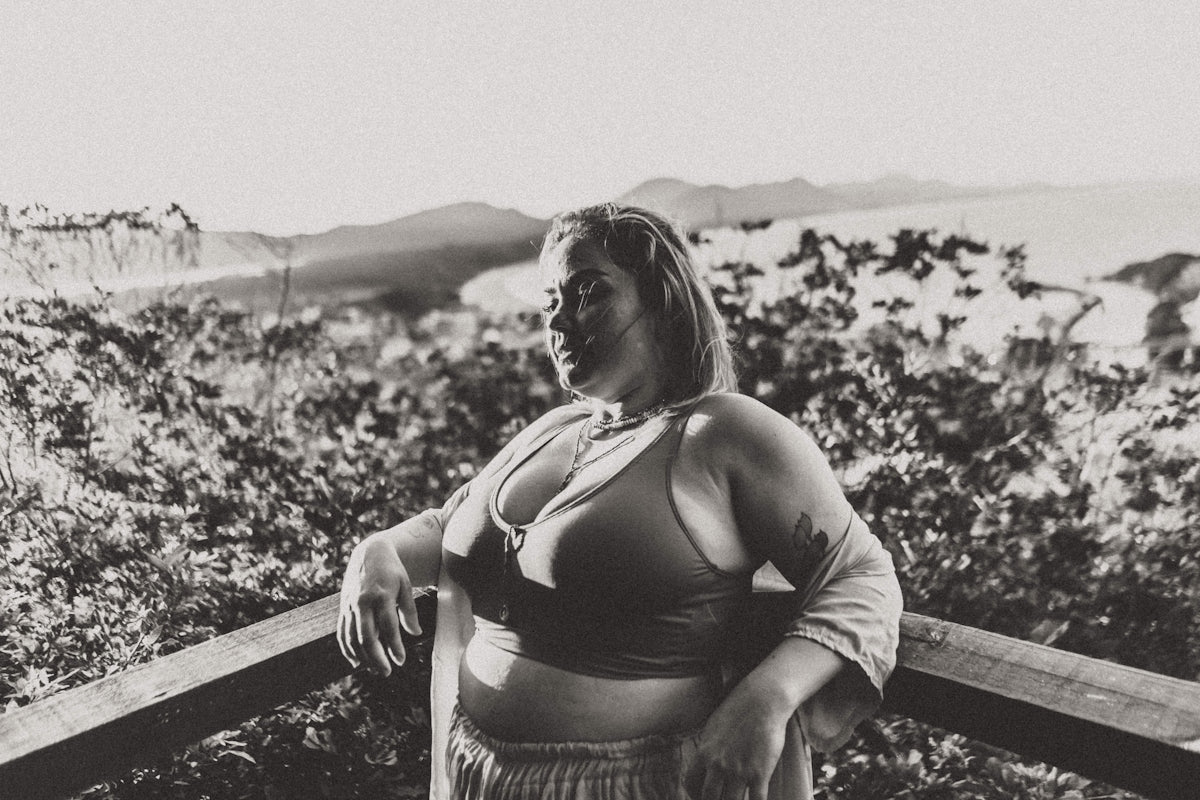 a woman sitting on a ledge