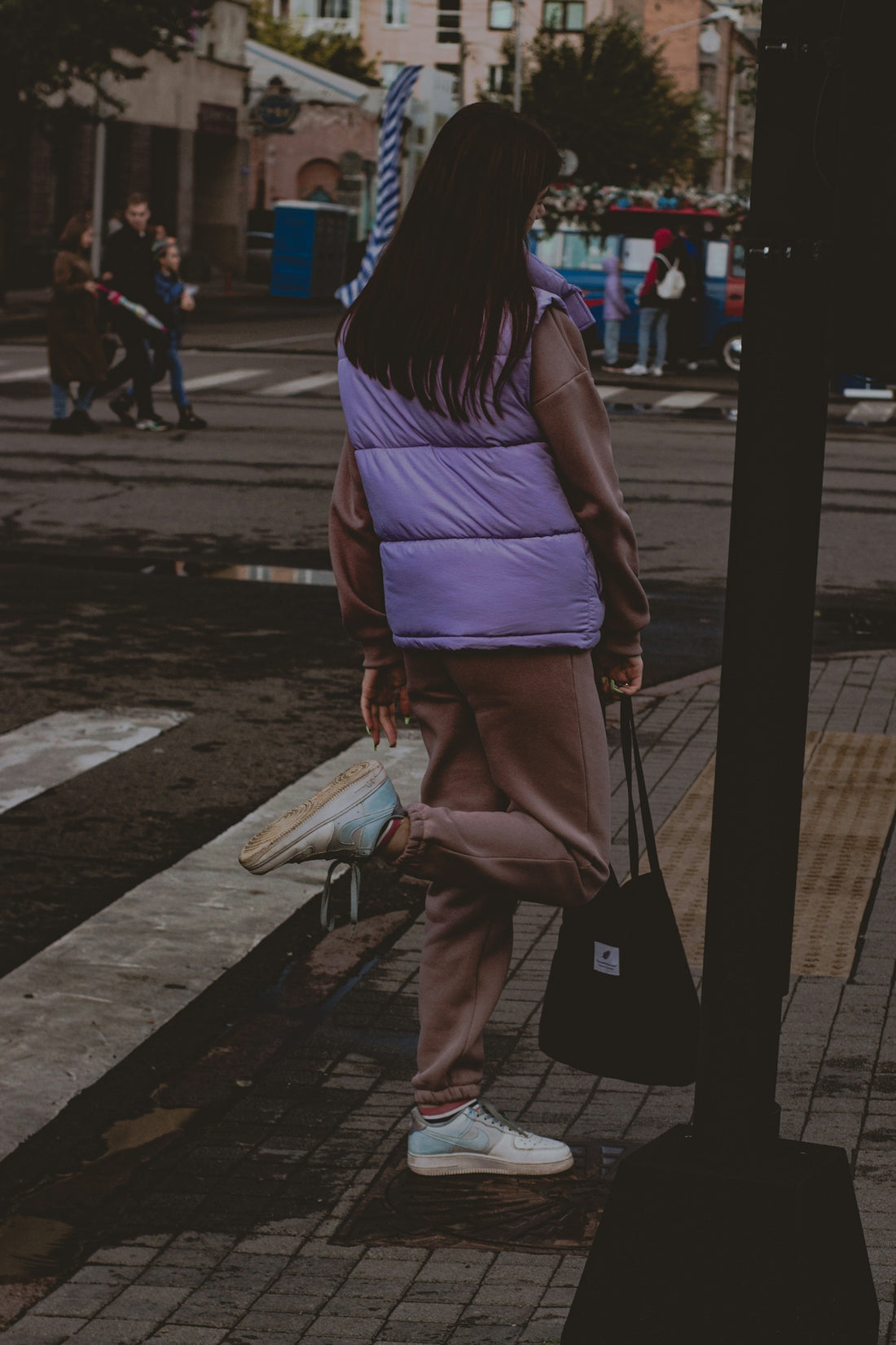 a person walking down a sidewalk