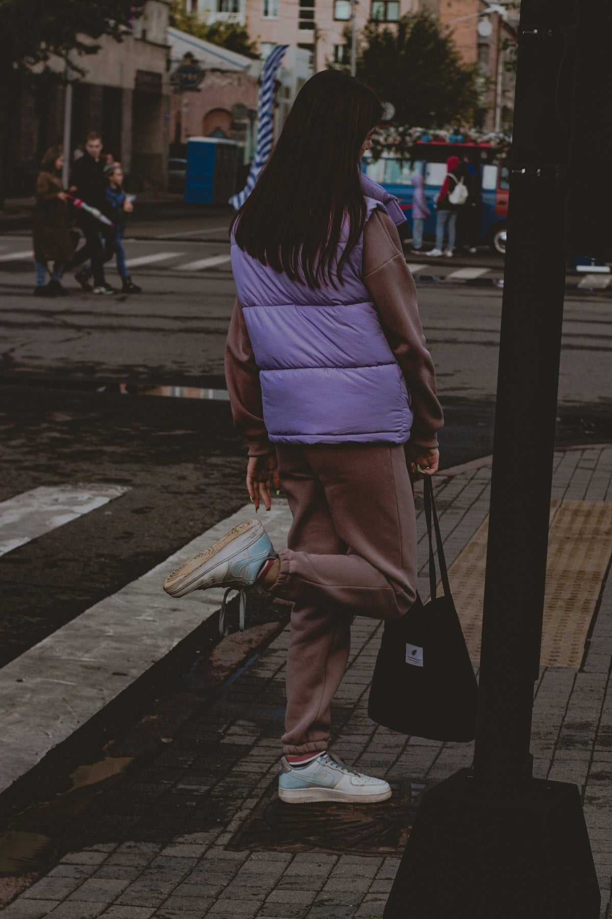 a person walking down a sidewalk