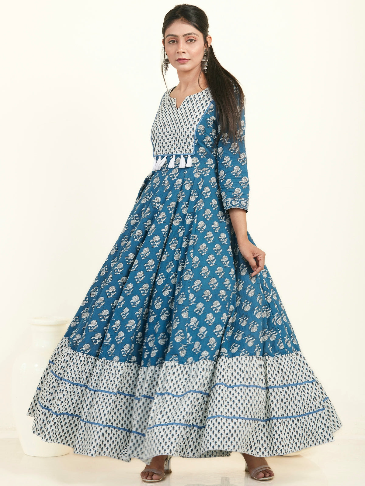 a woman in a blue and white dress