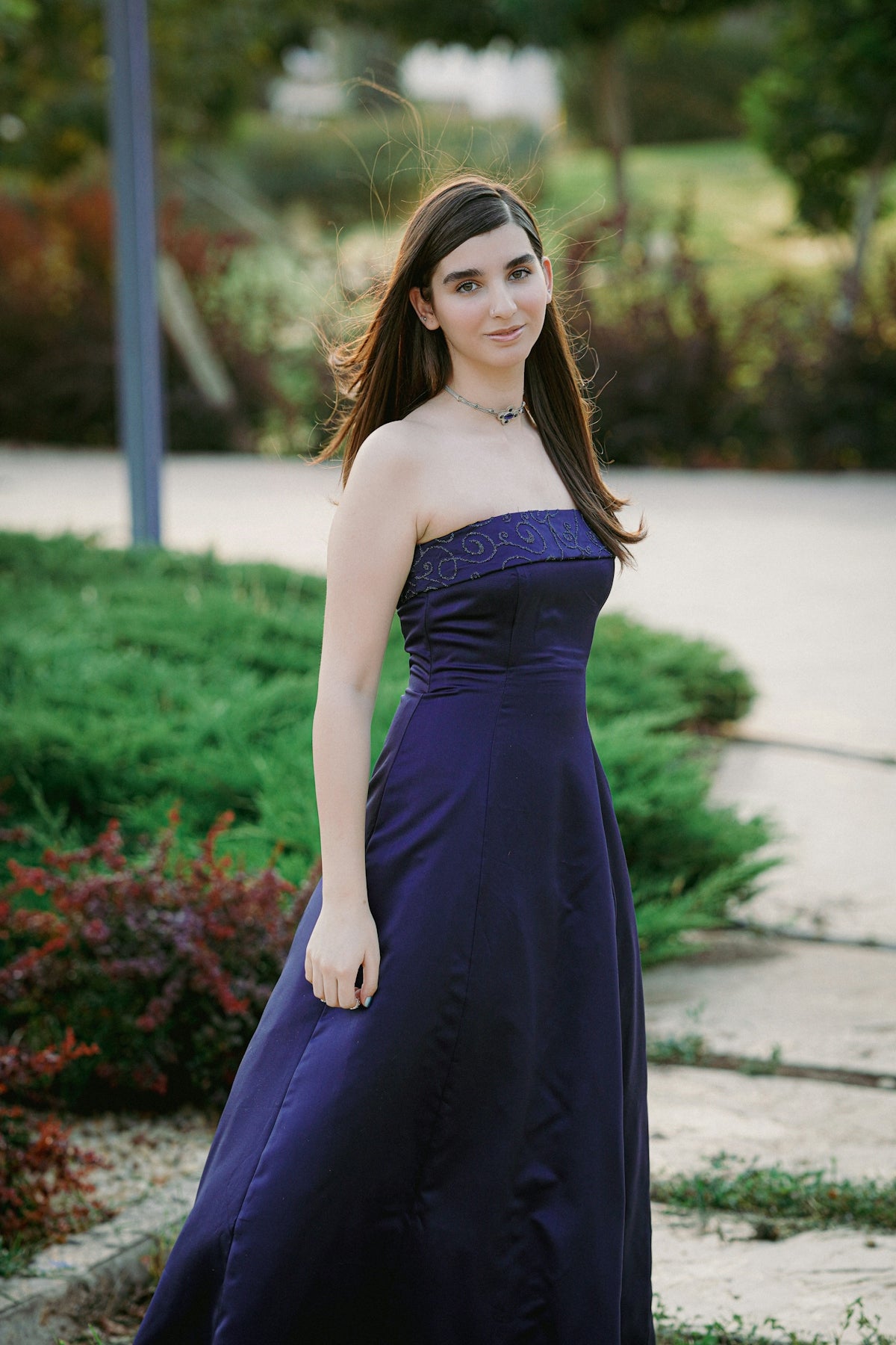 a woman in a blue dress posing for a picture