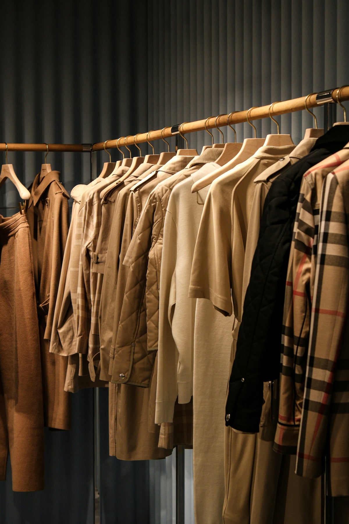 a rack of clothes hanging on a clothes line