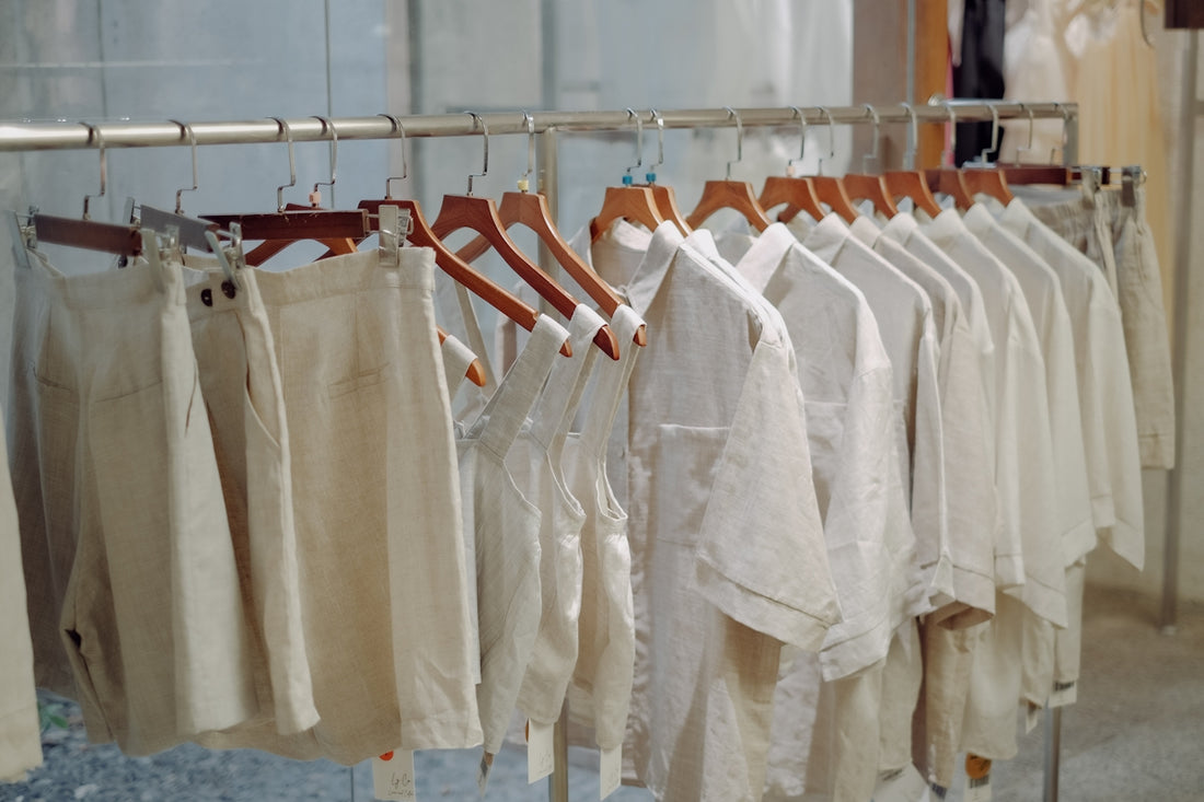 a bunch of pants hanging on a rack