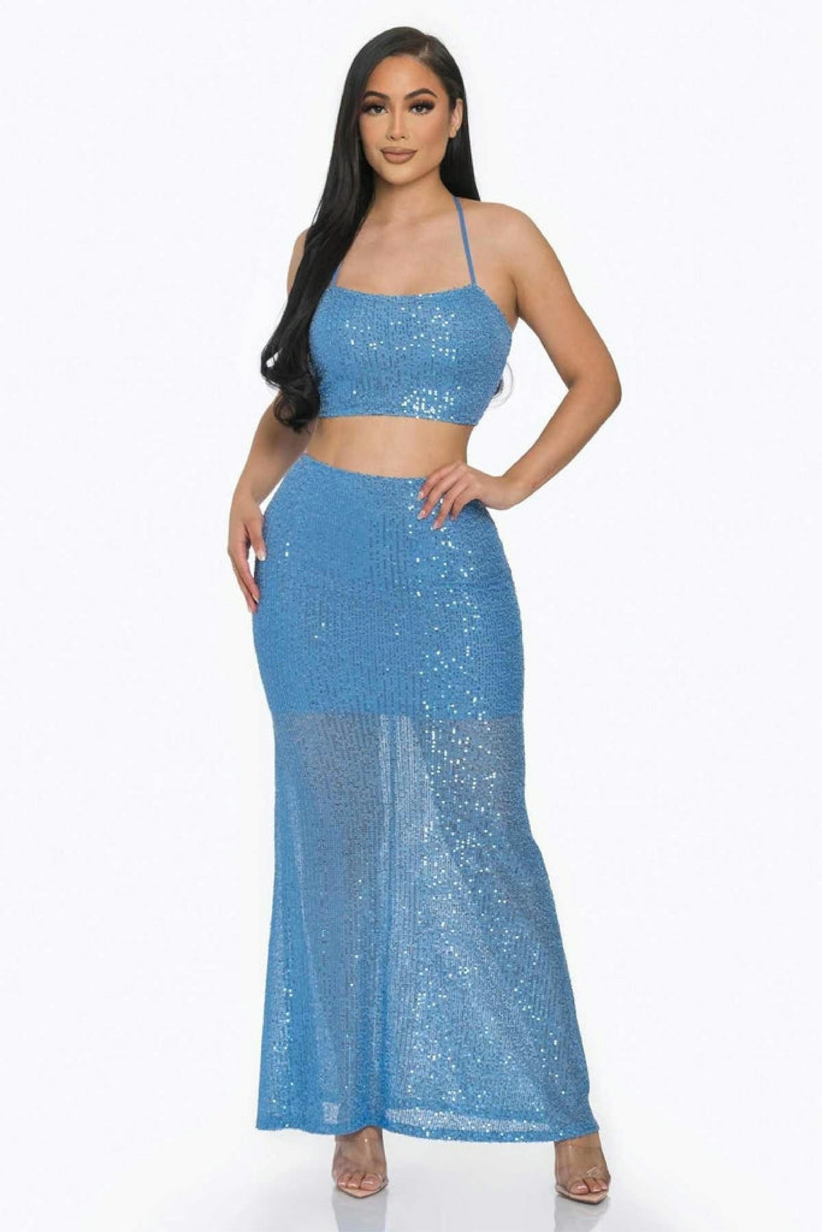 a woman in a blue dress posing for a picture
