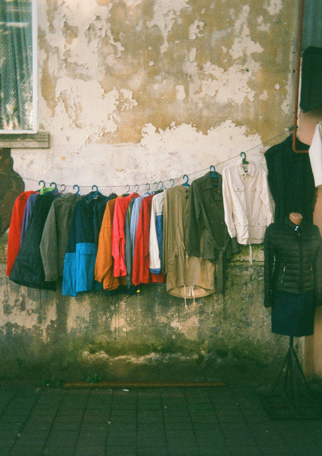A man standing in front of a clothes line