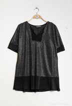 Glittrig blus i plusstorlek med yoke