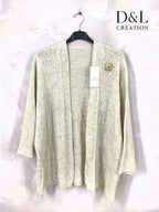 Open-knit cardigan with sun brooch sizes 38 to 52 i Stor Storlek