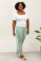 Two -color elastic size pants on the side and split hem i Stor Storlek