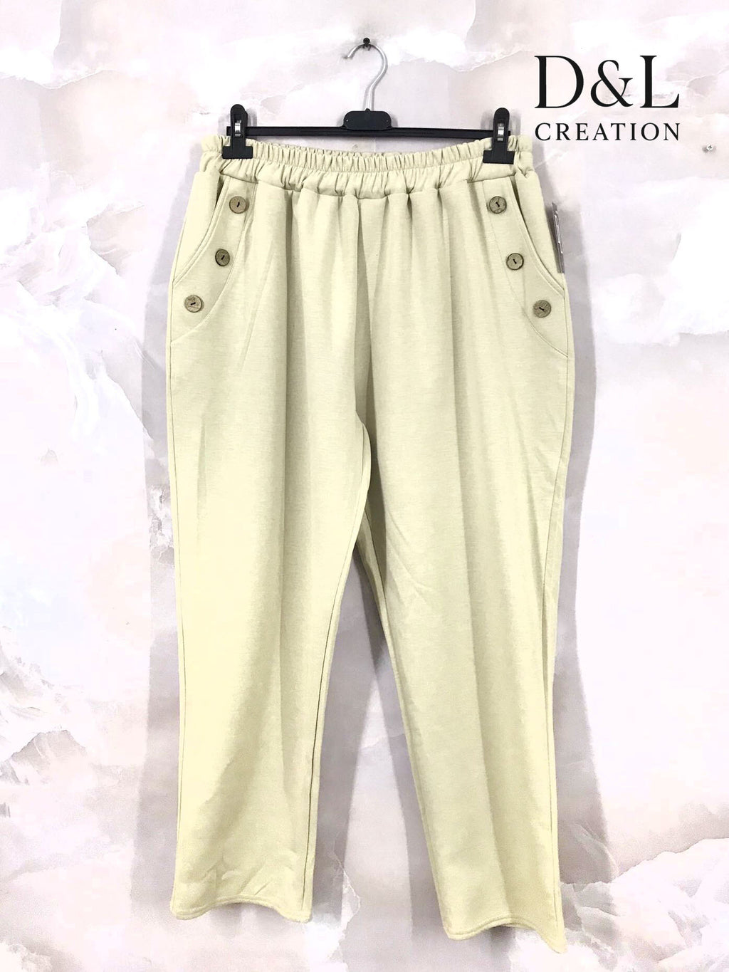 Sportbyxor i mjukt tyg med knappar och fickor, storlekar T38 till T50 i Stor Storlek