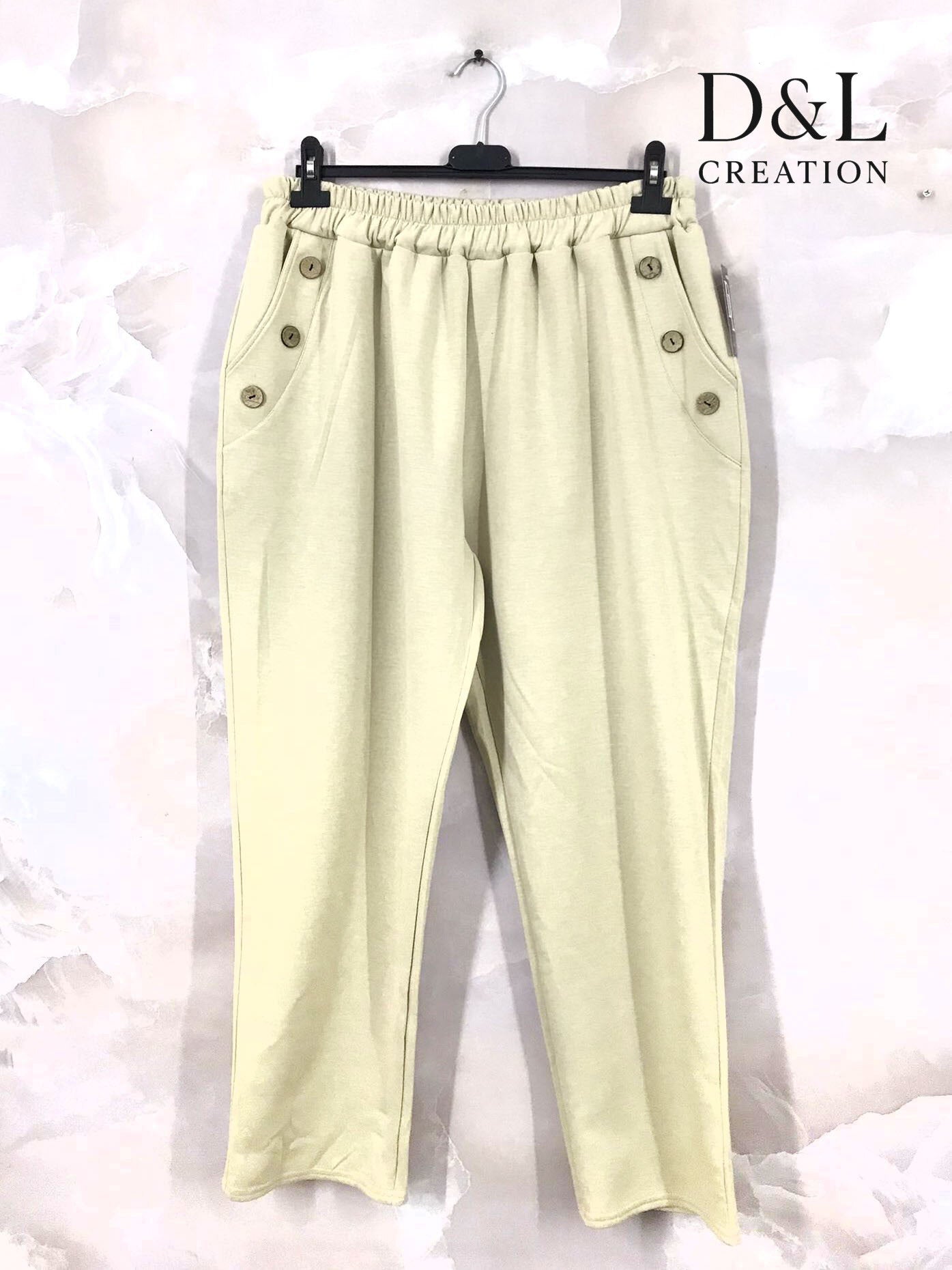 Sportbyxor i mjukt tyg med knappar och fickor, storlekar T38 till T50 i Stor Storlek