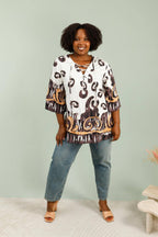 3/4 flared sleeve knot tunic i Stor Storlek