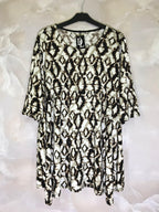 Plus Size Flared tunic with half-length sleeves in “swimsuit” material