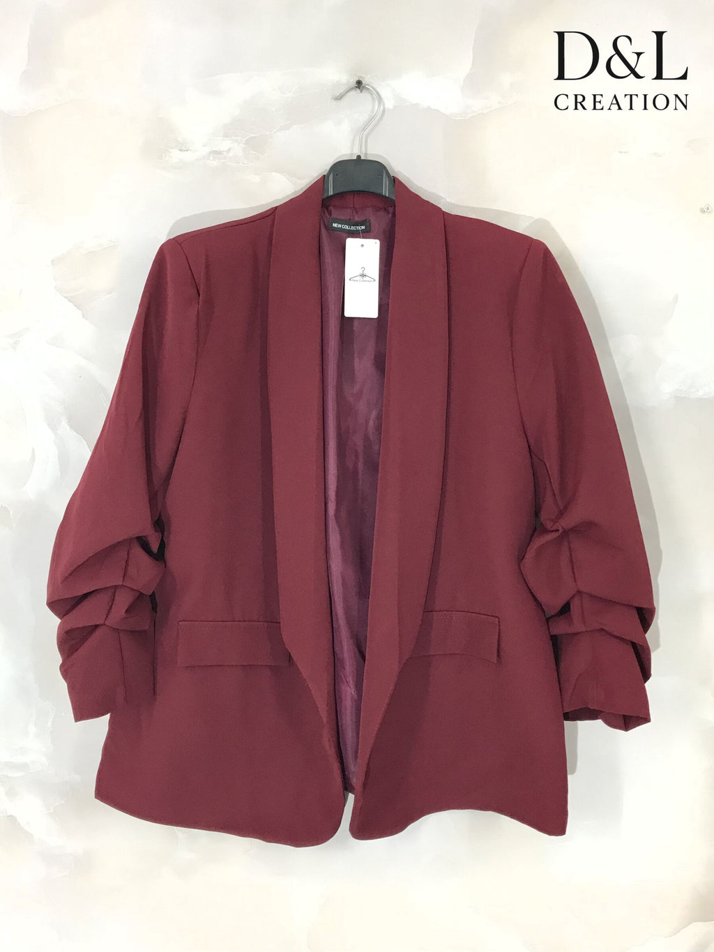 Blazer jacket with rolled-up sleeves and faux pockets