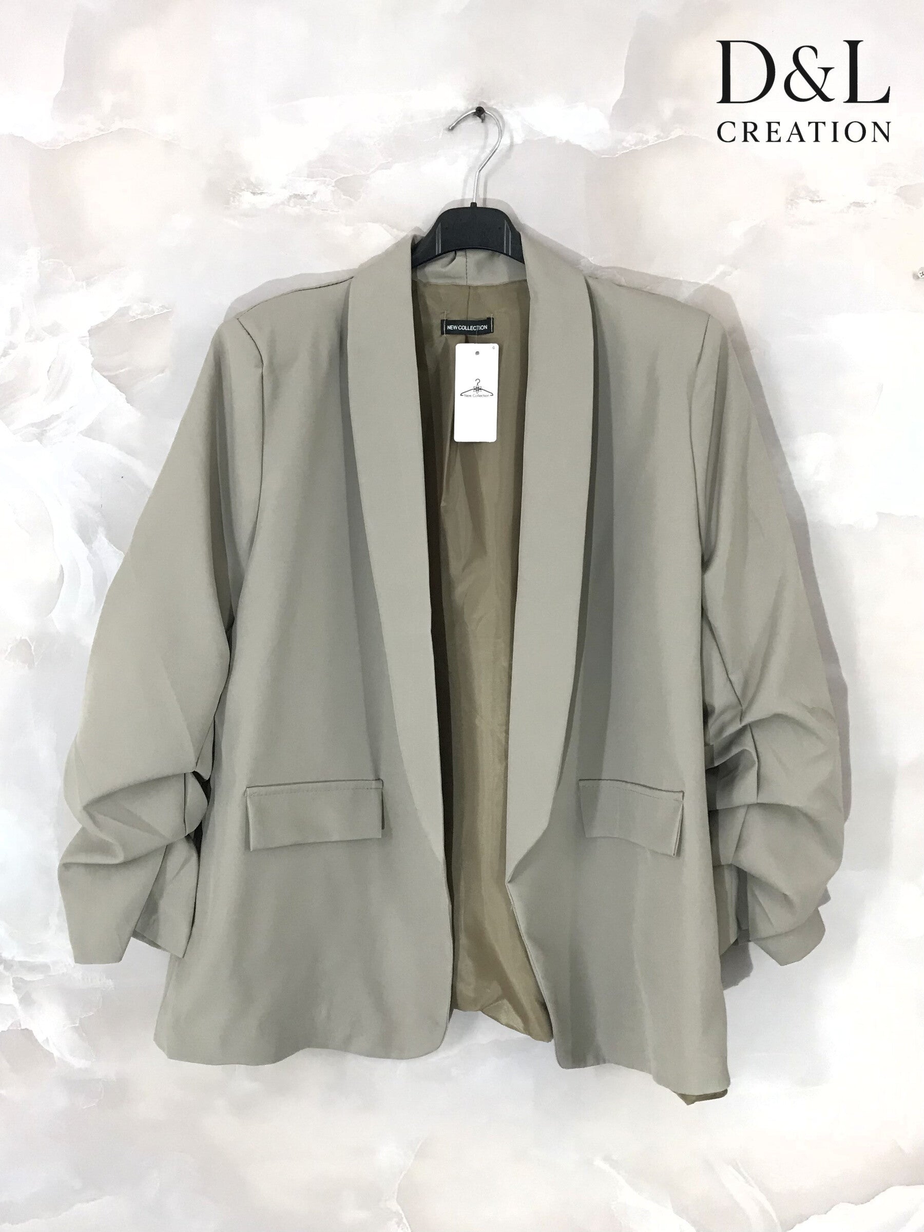 Blazer jacket with rolled-up sleeves and faux pockets